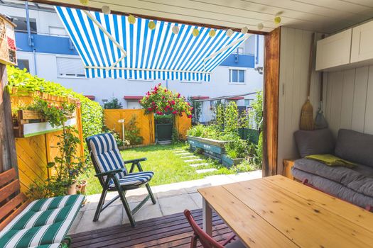 Cozy veranda with little green garden, summer time