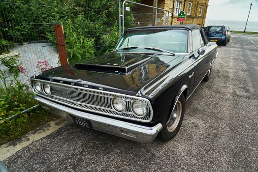 Hood scoop on a black 2 door convertible 1965 Dodge Coronet 500