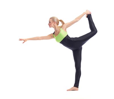 Flexible body. Full length shot of a fit young woman doing yoga against white background balancing on one leg posing gracefully copyspace