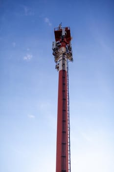 Technology on the top of the telecommunication GSM 5G,4G,3G tower.Cellular phone antennas on a building roof.Telecommunication mast television antennas.Receiving and transmitting stations