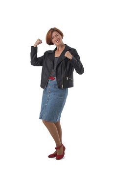 Happy woman winner in casual wear hold fists looking at camera, isolated over white background