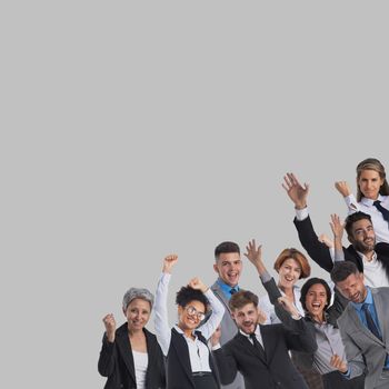 Large and very happy business group of people with arms raised over gray background corner design element