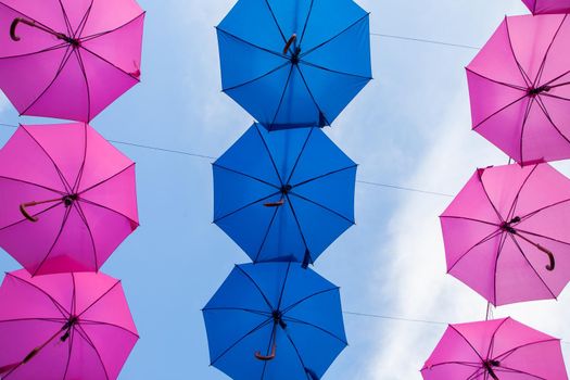 Different colours hanging umbrellas on Porcijunkulovo 2019