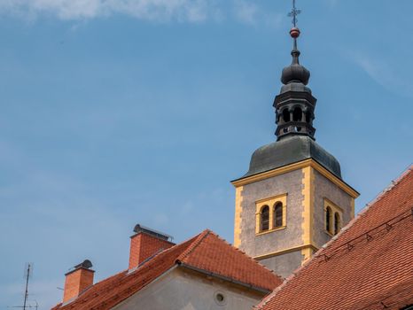 The tower of the church and convent of st. John the Baptist against the blue sky, Varazdin, Croatia. Part of an old town.