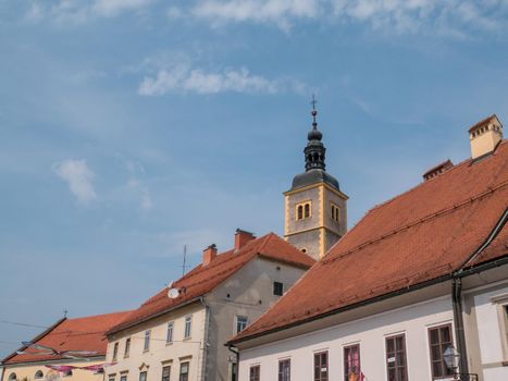 The tower of the church and convent of st. John the Baptist against the blue sky, Varazdin, Croatia. Part of an old town.