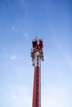 Technology on the top of the telecommunication GSM 5G,4G,3G tower.Cellular phone antennas on a building roof.Telecommunication mast television antennas.Receiving and transmitting stations