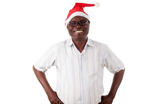 portrait of a happy man standing hands at the hip, with a Santa Claus hat isolated on a white background.
