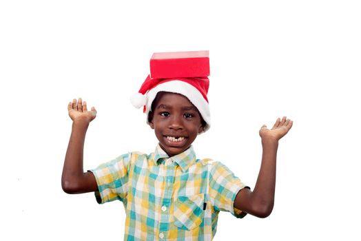 portrait of a happy little boy loading the gift box with his christmas present.