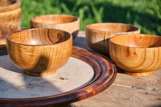 Wooden dishes on the table on the background of nature, Kazakhstan