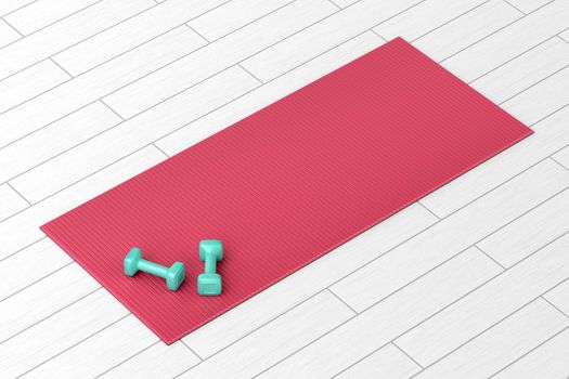 Two small dumbbells and rubber fitness mat on wood floor