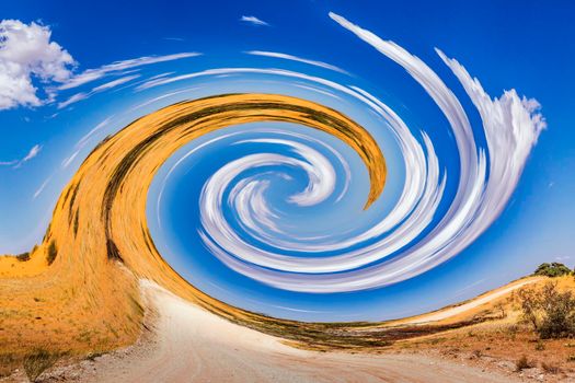 Desert red dune safari road with whirlwind effect in Kgalagadi transfrontier park, South Africa