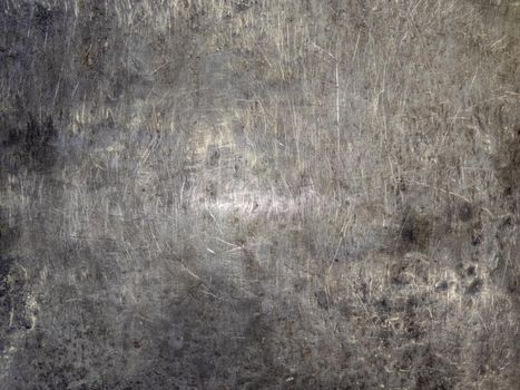 abstract thick bare scratched steel plate workbench or anvil close-up full frame background with selective focus