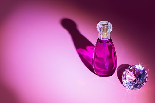 Perfume bottles studio shot on colored background with reflection. Perfumes, cosmetics, a collection of fragrances.