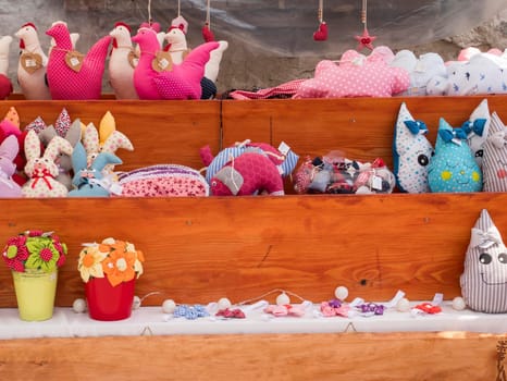 Plush figurines on stand set in a row. In the middle of the image is a place for text. Spancirfest 2019, Varazdin, Croatia. Špancirfest