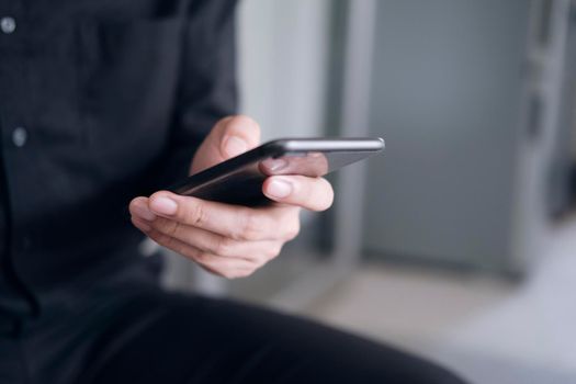 Young man using mobile phone. Using online connect technology for business, education and communication. 