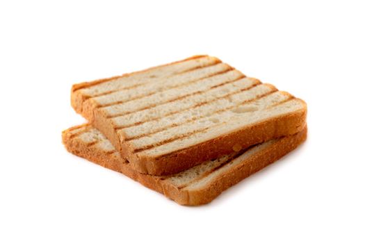 Slices of toast bread grilled with a golden crust isolated on white background