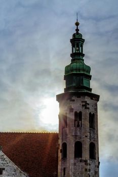 Church Saints Peter Paul Old Town, Krakow, Poland. Bell tower in the sun rays through the clouds