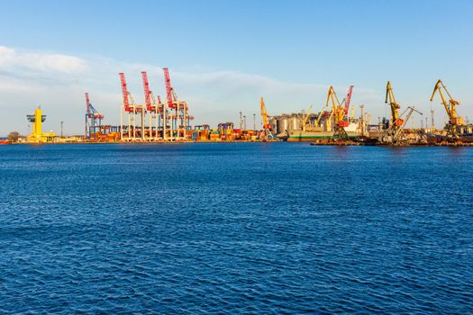 Cargo Port on the Black Sea coast, Odessa, Ukraine. View from afar on yellow loading cranes and containers