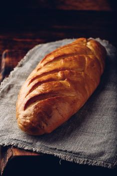 A loaf of bread on a wooden table