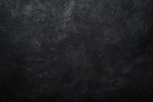 Dark textured concrete wall background. Copy space