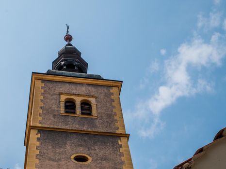 The tower of the church and convent of st. John the Baptist against the blue sky, Varazdin, Croatia. Part of an old town.