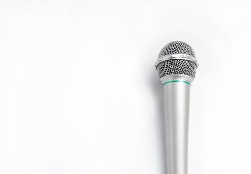 Silver microphone on white background.