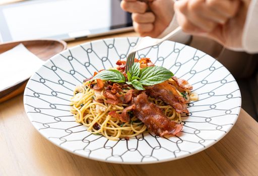 Spaghetti in a plate at a minimalist restaurant