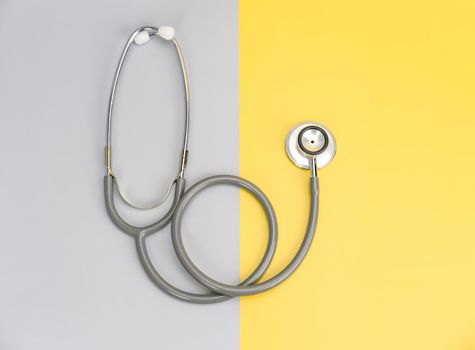 Stethoscope for doctor and copy space on color background