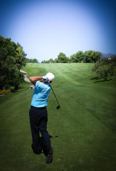 man golfer in action on a golf course