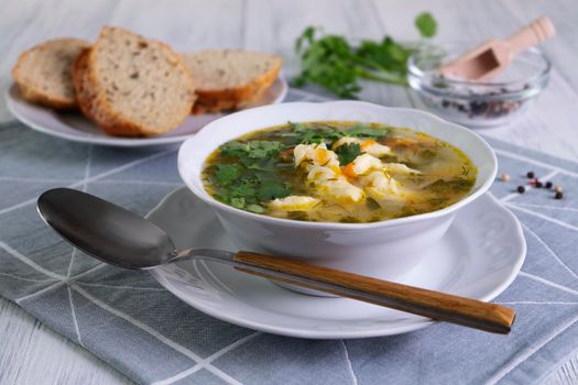 Close-up serving of vegetarian vegetable soup with dumplings. Healthy and dietary food. Vegetarianism. Selective focus.