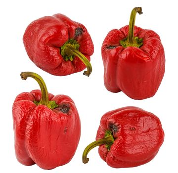 set of rotten red bell peppers isolated on white background.